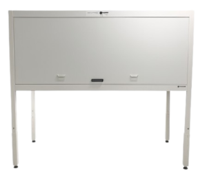 A white metal desk with a closed, lockable front panel and four legs. The panel has two small handles and a lock at the top center, making it ideal for use as a compact metal storage cabinet in strata-approved storage solutions.